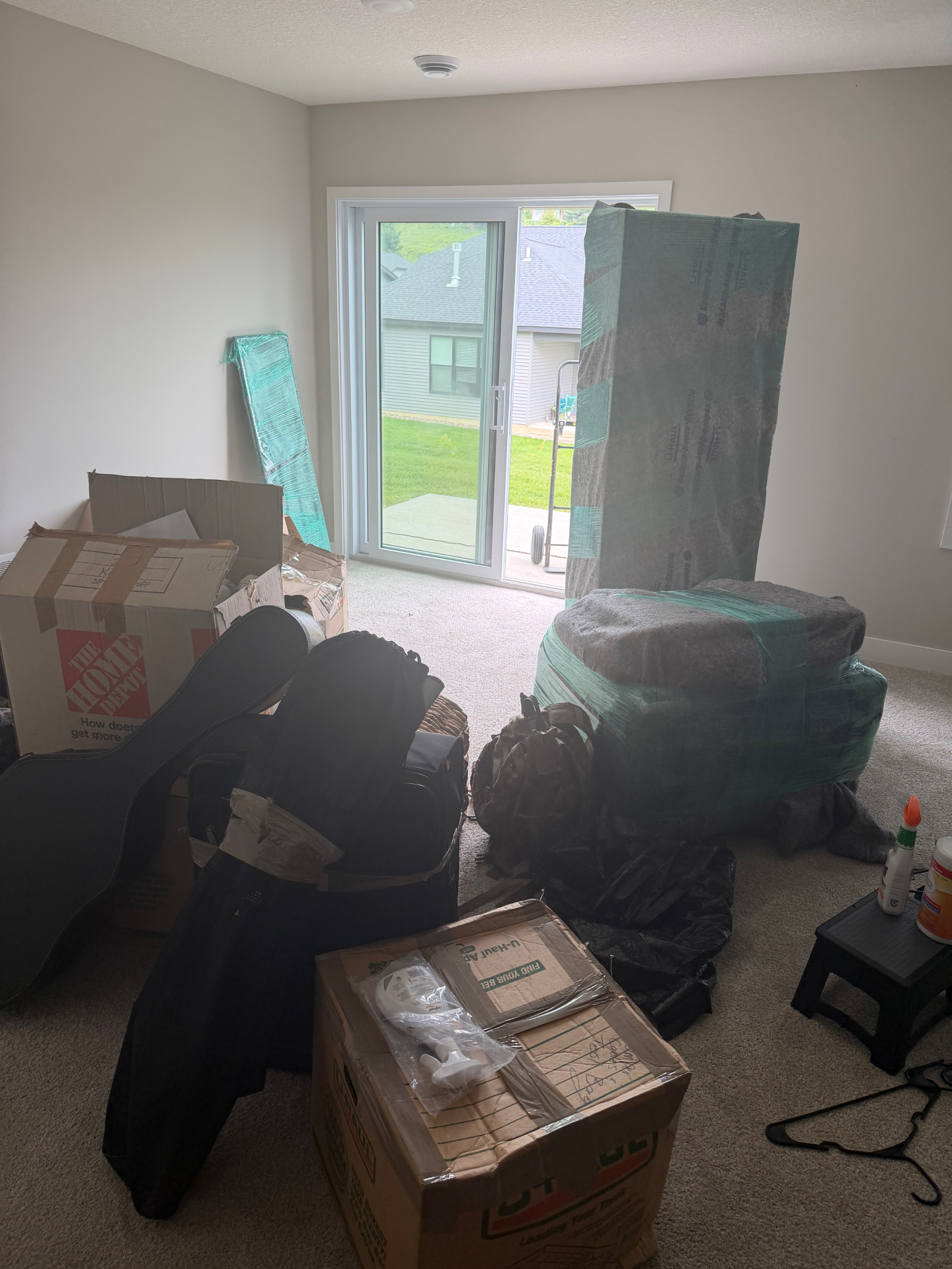 Wrapped mattress and boxes delivered into a new home