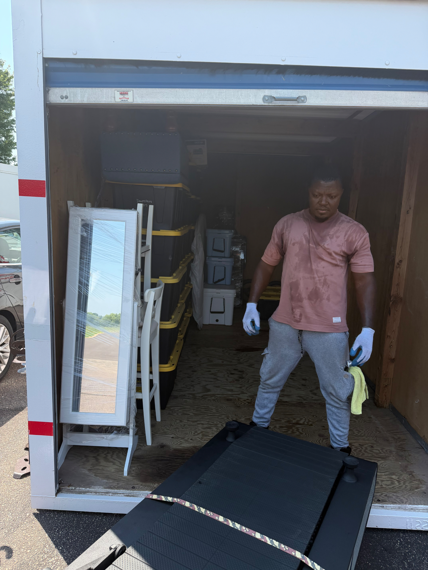 Burray Moving team member unloading a truck at a job site